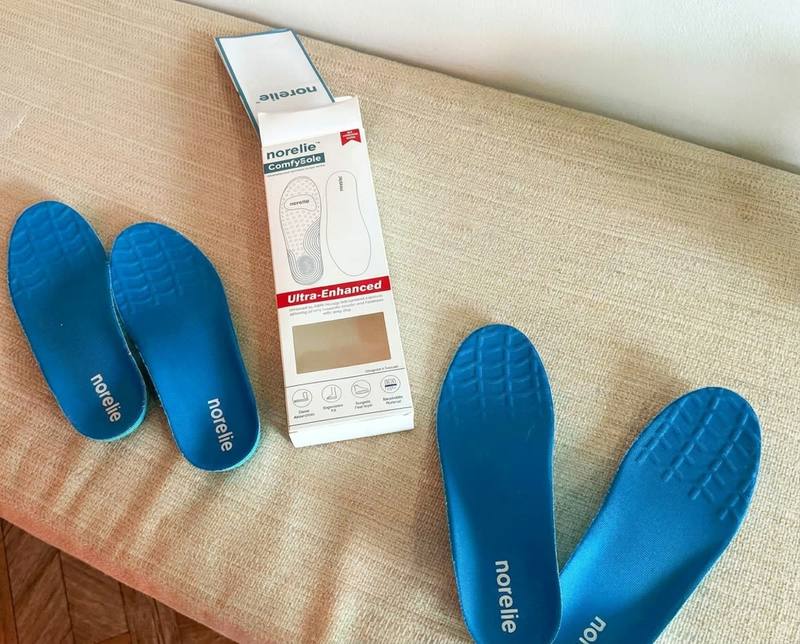 Two pairs of ComfySole 2.0 insoles with the Norelie retail box