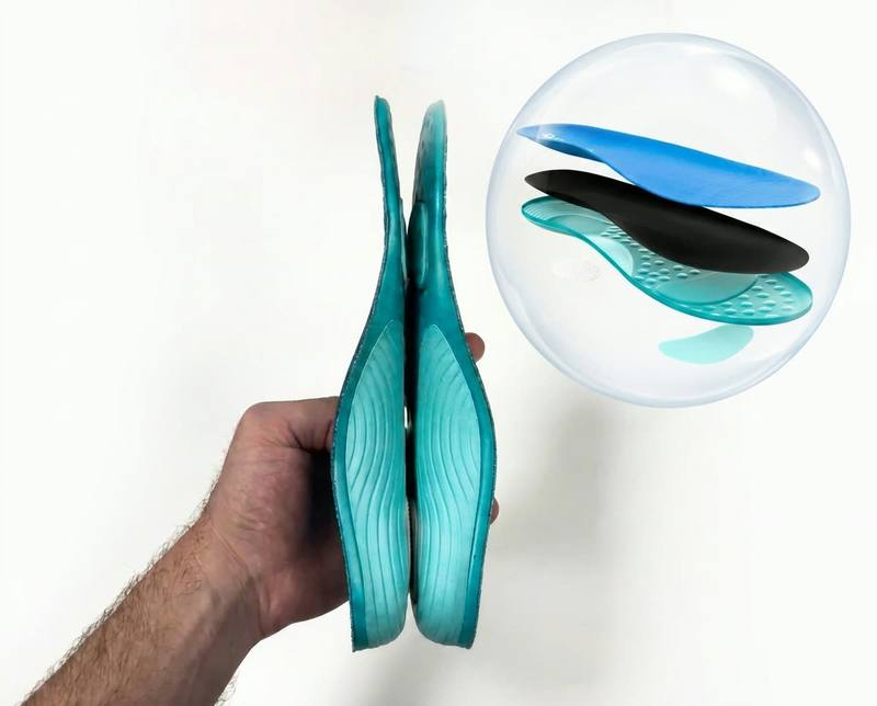 Holding the ComfySole 2.0 with an exploded view of its three-layer build